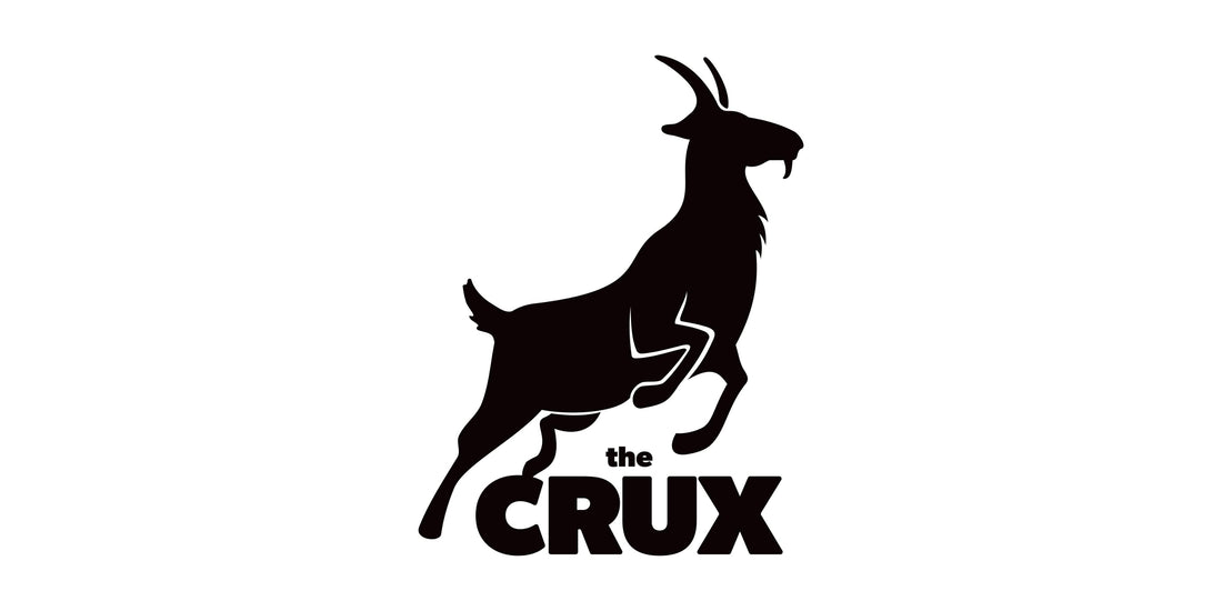 The Crux Melbourne bouldering logo with mountain goat jumping over text in black and white 